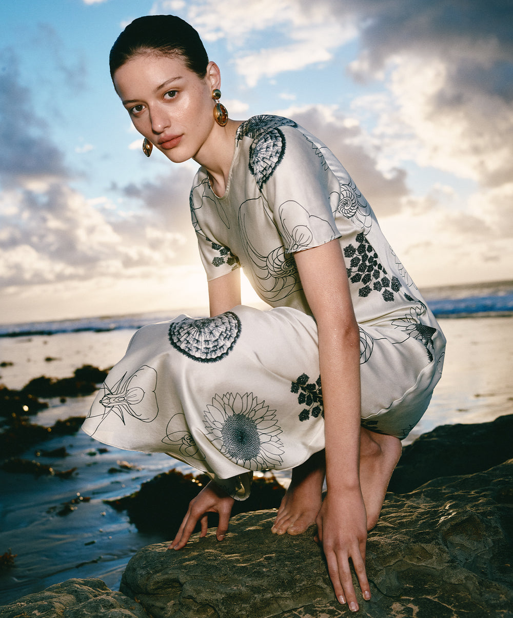 silk laundry white dress Introducing the Dive Dress, crafted from a cotton-silk blend with deep side pockets for functional wear. Available now in Margarita, Snapper and Black